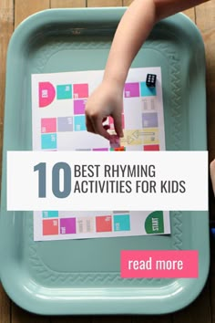 a child's hand on top of a blue tray with the words 10 best rhyming activities for kids