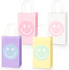 three bags with smiley faces on them are sitting in the middle of a white background