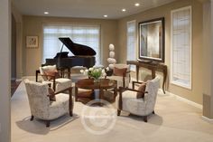 a living room filled with furniture and a piano