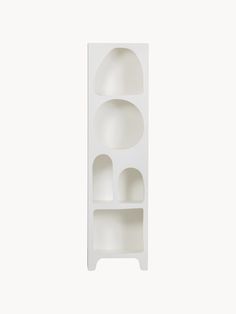 a white shelf with three shelves on each side and two smaller ones in the middle