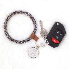 Convenience meets cute with this monogrammed key ring! Available in brown and in leopard, the brown metal key ring is laced through the middle of a duck boot cord so that it matches your monogrammed duck boots! This monogrammed key chain fits around your wrist easily, making it the perfect accessory to make keeping track of your keys cute and easy. Measuring 4 inches in diameter, this ring features a silver 1.375 inch silver disc for your monogram. Duck Boot, Marley Lilly, A Duck, Duck Boots, Accessories Shop, Key Rings, Key Ring, Free Gifts, Faux Fur