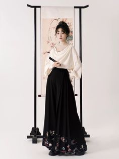 One of the most unique takes on modernized hanfu that we've ever seen! The Yimeng Huayu 遗梦花语 A Flower's Language Set has reimagined the cult favorite Mamian Qun 马面裙 (horse face skirt) and transformed it into the most fabulous pair of wide-legged trousers. Retaining the signature side pleats on the hips, these comfortable pants retain the shape and essence of the Mamian while making it modern ready! Perfect for cultural events, daily wear, office jobs, and visiting that new restaurant you've been Modernized Hanfu, Hanfu Modern, Office Jobs, Face Skirt, Wide Legged Trousers, Modern Hanfu, Drape Top, Horse Face, Comfortable Pants