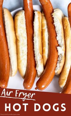 four hot dogs in buns with the words air fryer hot dogs