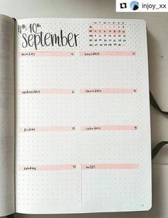 an open planner with pink and black writing on it