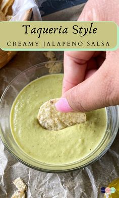 a person dipping something in a bowl with bread on the side and text overlay that reads tageria style creamy jalapeno salsa