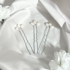 A dainty statement - our gorgeous pearl petal hair pins are the perfect statement, they come as a collection of three!  Available in Solid Sterling Silver, these lovely hair pins add the perfect touch to your bridal hairstyle. Handcrafted with care in Dorset, it's perfect for both everyday wear and special occasions. Presented in a branded pouch, these hairpins are ideal for a wedding or bridal gift, offering timeless elegance for a memorable day. Bridal Hairstyle, Pearl Hair Pins, Bridal Gift, Pearl Hair, Bridal Gifts, Bride Gifts, Pearl White, Bridal Hair, Hair Pins