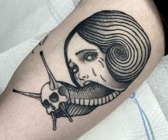 a black and white tattoo with a woman's face