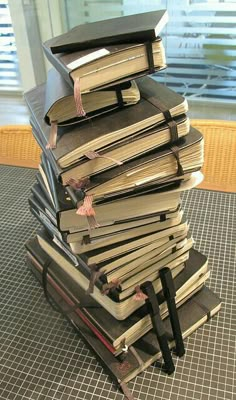 a stack of books sitting on top of each other