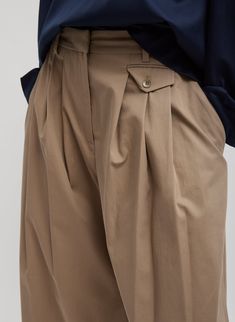 The Bio Twill Triple Pleat Pant is meticulously crafted from premium bio twill fabric based in Italian light weight gabardine, sanded, and washed with water repellent, providing a luxurious feel with outstanding durability. With snap details at the leg for three hemline variations, these versatile wide-leg pants add functionality and utility to any CP wardrobe. These pants fit mid-rise. They sit just below the waist and above the high hip. 100% Cotton Style Number: F124BT3378 Available in: Black Designer Bottoms, Fall Outerwear, Summer Handbags, Pleated Pants, Sweater Sale, Denim Flares, Twill Fabric, Jacket Sale, Denim Pant