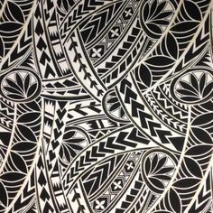 an intricate black and white pattern on fabric