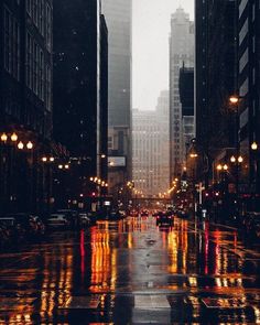 an empty city street at night in the rain