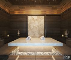 a spa room with stone flooring and wooden walls