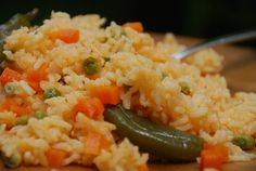 rice and vegetables are mixed together on a plate