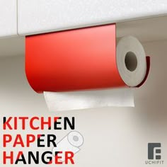 a kitchen paper hanging on the wall with a roll of toilet paper in front of it