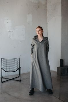 Wrap yourself in warmth and elegance with our wool maxi dress, designed to combine comfort and style. This dress features a flattering V-neckline and a cozy hood, making it perfect for cooler weather. The flowing maxi-length silhouette offers a relaxed yet refined look, while the side pockets add a practical touch.  Crafted from high-quality wool, this dress provides warmth and style. Whether you're dressing it up for a special occasion or keeping it casual, this versatile piece is perfect for a Winter Dress For Women, Maxi Dress Winter, Casual Maxi Dress, Cozy Dress, Dress Winter, Dress Bohemian, Wool Clothing, Winter Dress, Maxi Dresses Casual