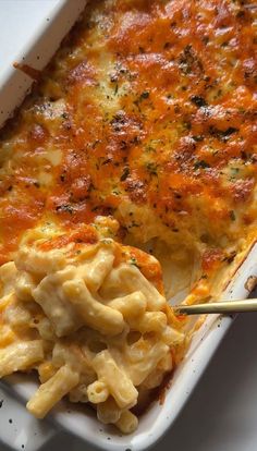 a casserole dish with macaroni and cheese in it, ready to be eaten