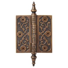 an ornate wooden bookend with two books on it's sides and a decorative design