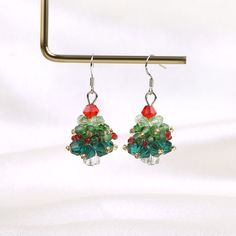 Crystal Christmas Tree Earrings for Women | 925 Sterling Silver Handmade Christmas tree Earrings | Christmas Jewelry | Christmas Party Gift 🎄Introducing our exquisite Crystal Christmas Tree Earrings for Women, a stunning piece of handmade Christmas jewelry that will captivate and accentuate your festive style. These earrings are meticulously crafted using high-quality crystal to create intricately designed Christmas trees, each adorned with sparkling crystals. The unique combination of elegance Christmas Celebration Jewelry Drop Earrings, Christmas Celebration Drop Earrings Jewelry, Festive Christmas Jewelry With Matching Earrings, Christmas Celebration Dangle Earrings, Christmas Celebration Jewelry With Matching Earrings, Christmas Drop Earrings For Celebration, Christmas Dangle Jewelry For Celebration, Dangle Jewelry For Christmas Celebration, Christmas Celebration Dangle Jewelry