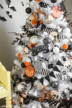 a decorated halloween tree with black and white decorations