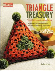 a crocheted triangle on the cover of a book