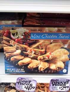 some kind of chicken tacos on display in a store