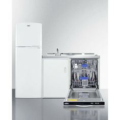 an empty dishwasher sitting next to a white refrigerator