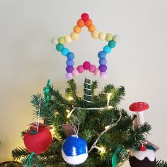 a small christmas tree decorated with colorful ornaments