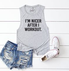 a tank top that says i can't i have to workout next to shorts