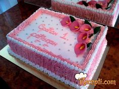 two pink birthday cakes sitting on top of a table