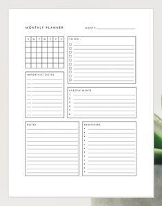 the printable planner is next to a plant