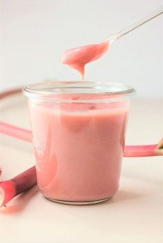 a pink substance is in a glass jar