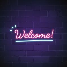 a neon welcome sign on a brick wall