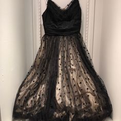 This Is My Grandmothers Dress From The Early 50's. It's In Great Condition With Double Black Polka Dot Tulle And Double Lining. This Is A Well Made Dress That Unfortunately Is Too Small For Me. There Is No Tag, But It Would Fit A Small - X Small. Measurements From Center Of Neckline To Bottom Is 33", From Top Of Straps Is 43" And The Width Underneath Chest Is 11.5”. 1950s Prom, 1950s Prom Dress, 1950's Dress, Double Black, Made Dress, 1950s Dress, Black Polka Dot, Polka Dot, Prom Dresses