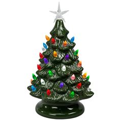 a green ceramic christmas tree with multi - colored lights