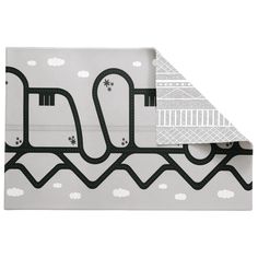 an image of a folded piece of paper with black and white designs on the side