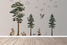 a room with some animals and trees on the wall