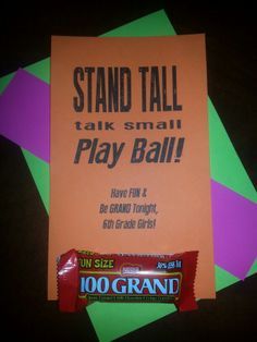 an orange sign with a candy bar next to it on top of a green and purple background