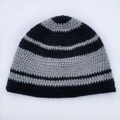 a crocheted black and gray hat on a white background