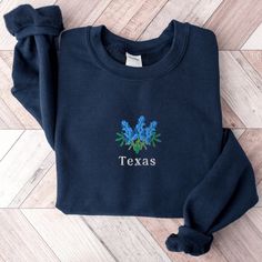 Blue Tops With Letter Embroidery For Spring, Embroidered Cotton Blue Sweatshirt, Blue Embroidered Crew Neck Top, Winter Blue Tops With Letter Embroidery, Blue Tops With Letter Embroidery For Winter, Blue Winter Tops With Letter Embroidery, Navy Embroidered Cotton Tops, Blue Long Sleeve Sweatshirt With Floral Embroidery, Blue Sweatshirt With Letter Embroidery For Spring