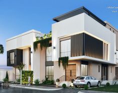 two cars are parked in front of a modern house with balconies and palm trees