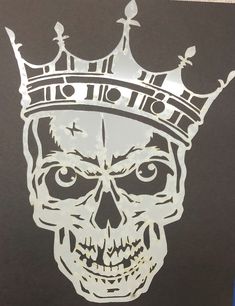 a skull with a crown on it's head is shown in this stencil