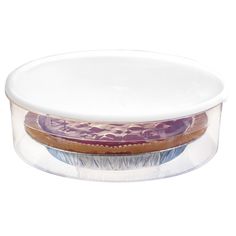 a plastic container filled with food on top of a white table