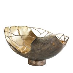 a metal bowl sitting on top of a wooden stand