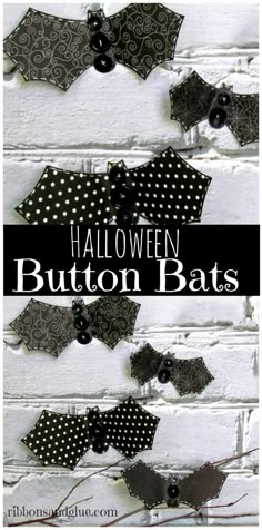 several black and white polka dot bows hanging on a brick wall with the words halloween button bats