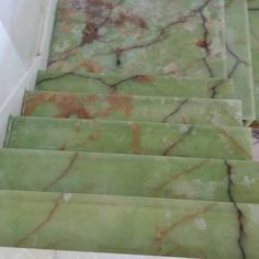 green marble stairs leading up to the top