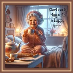 an old woman sitting on her bed drinking tea and smiling at the camera with a quote above it that reads, start each day with a happy heart