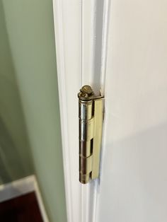 an open door with a metal handle on it