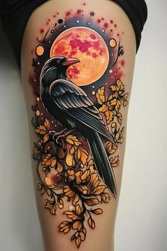 a black bird sitting on top of a tree branch with the moon in the background