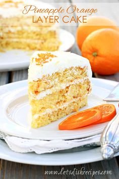 a slice of cake on a white plate with an orange and fork next to it