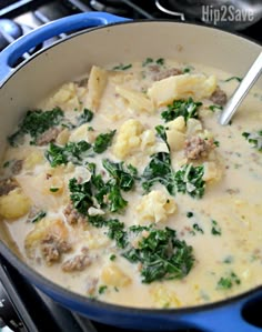 a blue pot filled with food on top of a stove